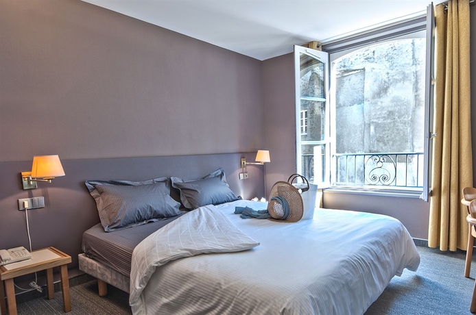 Imagen de la habitación del Hotel De La Cité. Foto 5