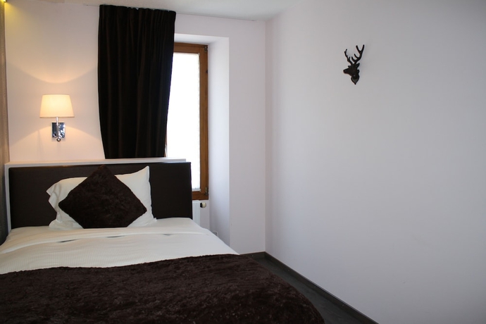 Imagen de la habitación del Hotel De La Gare, Monthey. Foto 18