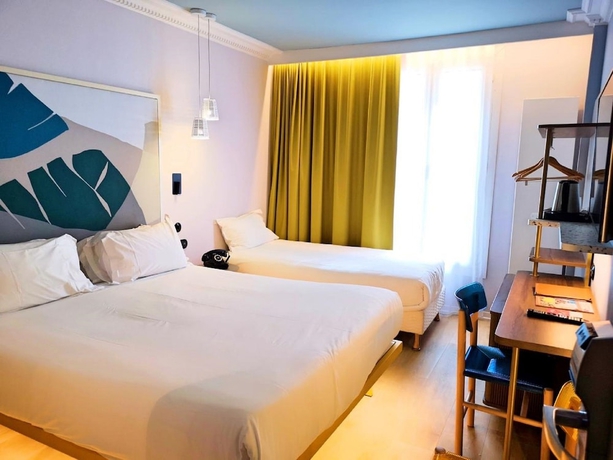 Imagen de la habitación del Hotel De La Paix, París. Foto 5