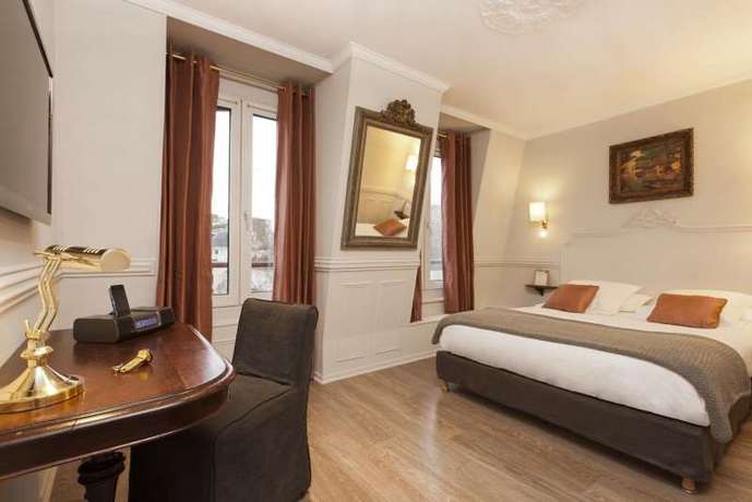 Imagen de la habitación del Hotel De La Porte Dorée. Foto 8