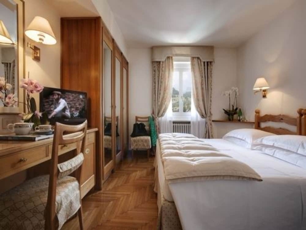 Imagen de la habitación del Hotel De La Poste, Cortina d'Ampezzo . Foto 12