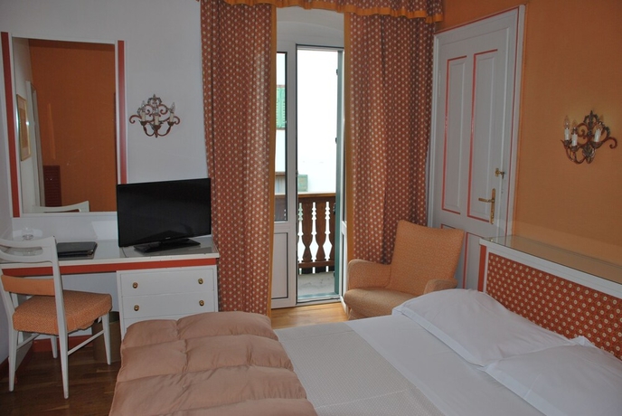 Imagen de la habitación del Hotel De La Poste, Cortina d'Ampezzo . Foto 13