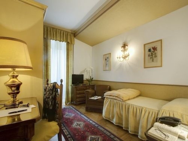 Imagen de la habitación del Hotel De La Poste, Cortina d'Ampezzo . Foto 17