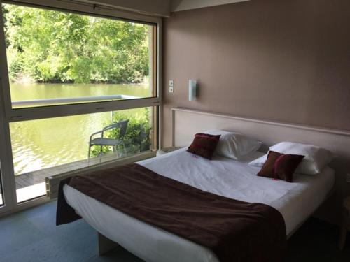 Imagen de la habitación del Hotel De L'ile Du Saussay. Foto 7