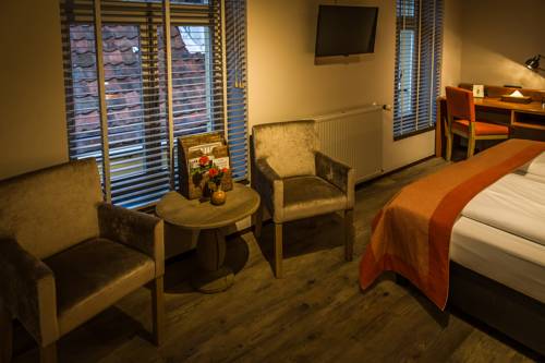Imagen de la habitación del Hotel De Limbourg. Foto 6