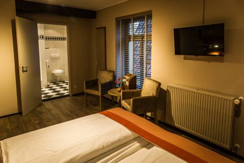 Imagen de la habitación del Hotel De Limbourg. Foto 8