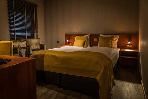 Imagen de la habitación del Hotel De Limbourg. Foto 13
