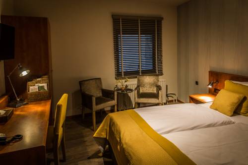 Imagen de la habitación del Hotel De Limbourg. Foto 14