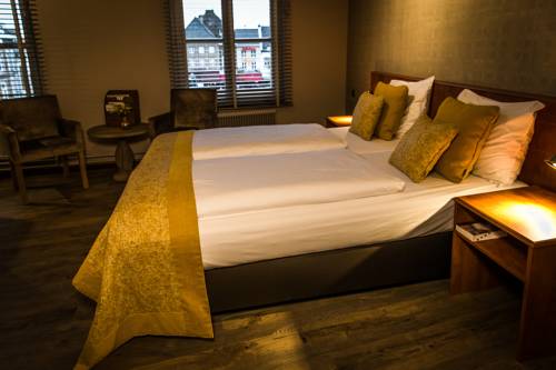Imagen de la habitación del Hotel De Limbourg. Foto 16