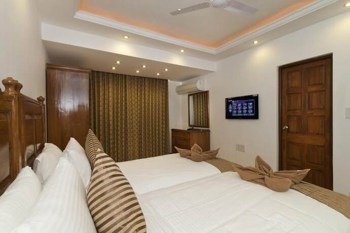 Imagen de la habitación del Hotel De Mandarin Beach Resort Suites and Villas. Foto 15