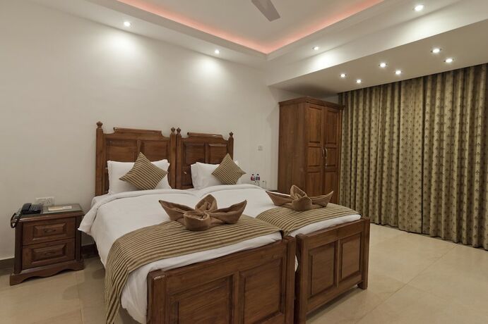 Imagen de la habitación del Hotel De Mandarin Beach Resort Suites and Villas. Foto 19