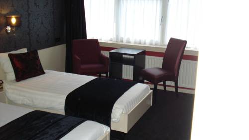 Imagen de la habitación del Hotel De Postelse Hoeve. Foto 7