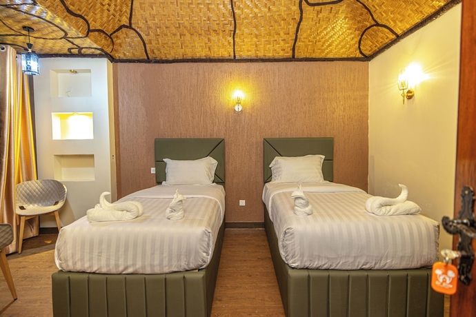 Imagen de la habitación del Hotel De Rain Eco Beach Resort. Foto 5
