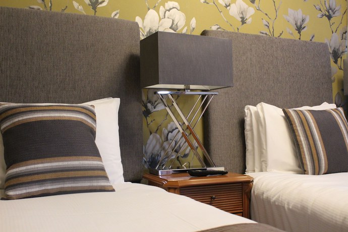 Imagen de la habitación del Hotel De Rougemont Manor and Suites. Foto 3