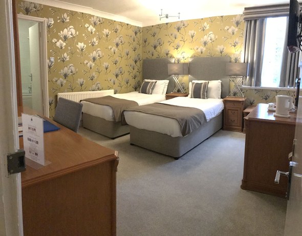 Imagen de la habitación del Hotel De Rougemont Manor and Suites. Foto 7