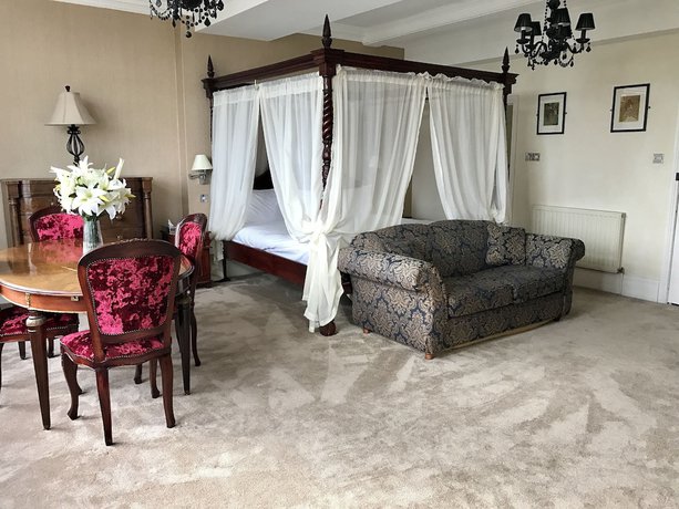 Imagen de la habitación del Hotel De Rougemont Manor and Suites. Foto 9