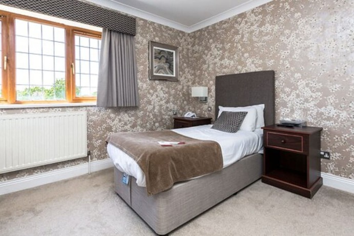 Imagen de la habitación del Hotel De Rougemont Manor and Suites. Foto 15
