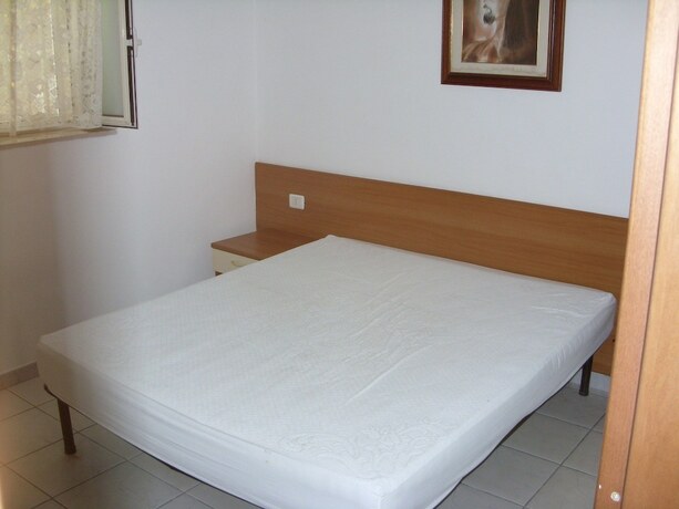 Imagen de la habitación del Hotel De Sio Camping Residence. Foto 19