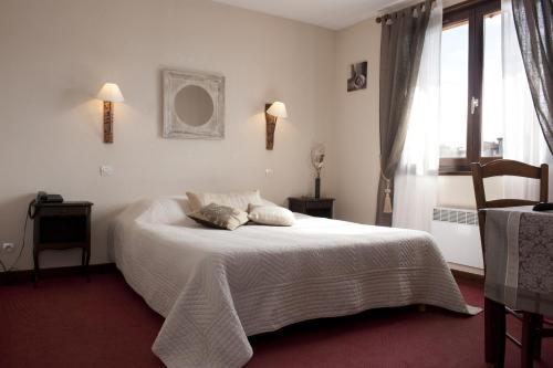 Imagen de la habitación del Hotel De Vignes. Foto 7