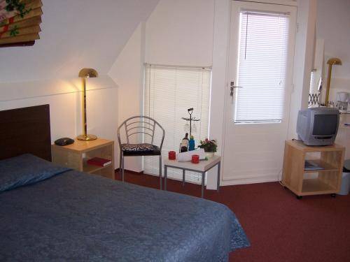 Imagen de la habitación del Hotel De Weyman. Foto 9