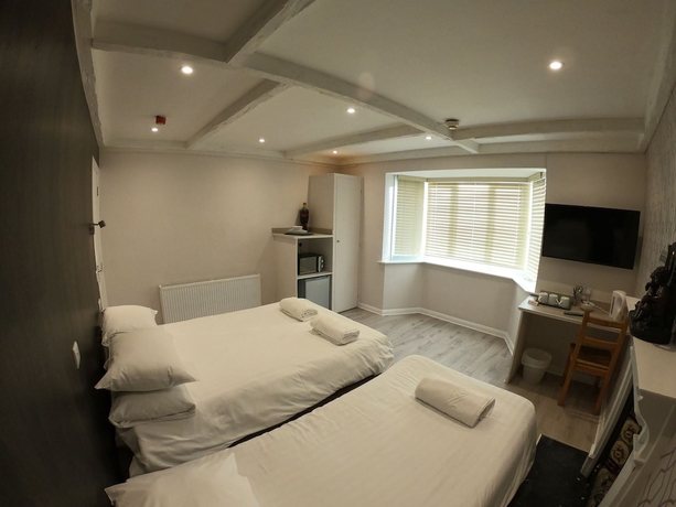 Imagen de la habitación del Hotel Debden Guest House. Foto 6