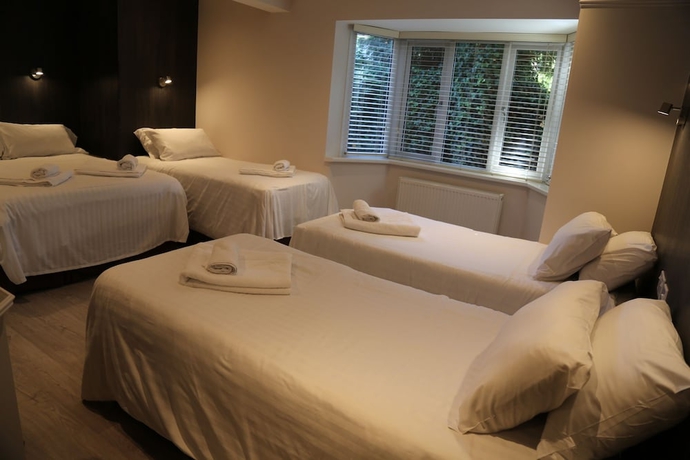 Imagen de la habitación del Hotel Debden Guest House. Foto 12