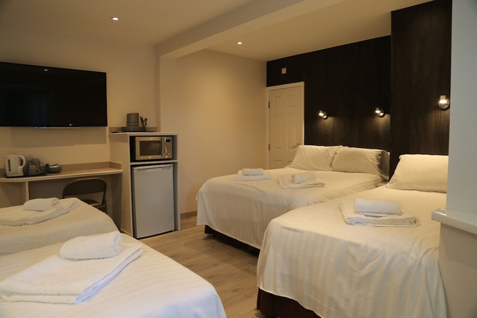 Imagen de la habitación del Hotel Debden Guest House. Foto 15