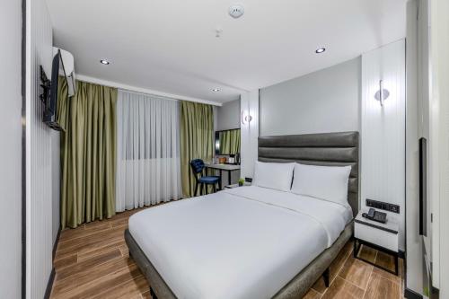 Imagen de la habitación del Hotel Dedem Premium - &Ccedil;orlu. Foto 19