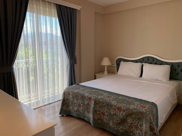 Imagen de la habitación del Hotel Defne Beach. Foto 15