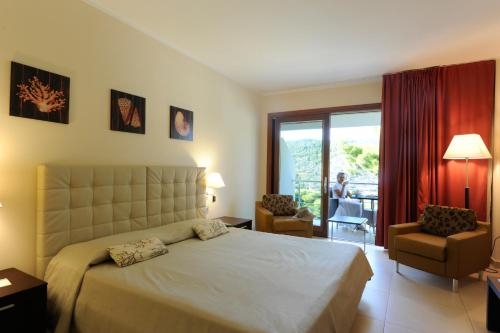 Imagen de la habitación del Hotel Del Faro - Pugnochiuso Resort. Foto 10