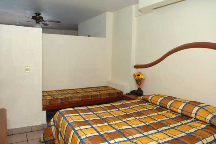 Imagen de la habitación del Hotel Del Real and Suites. Foto 7