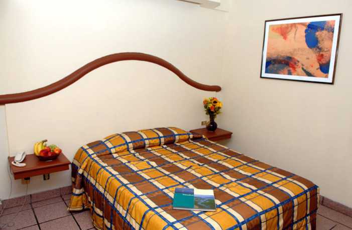 Imagen de la habitación del Hotel Del Real and Suites. Foto 8