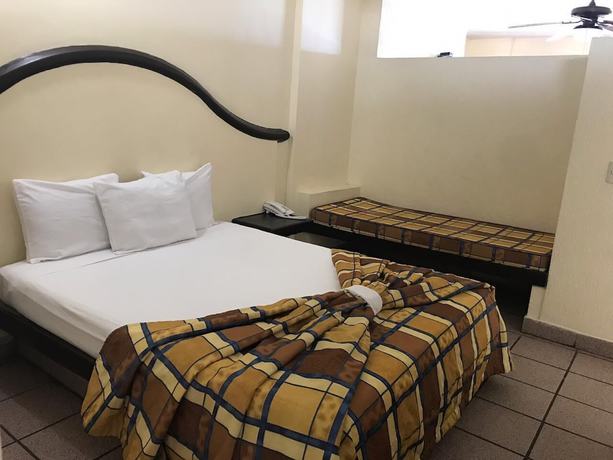 Imagen de la habitación del Hotel Del Real and Suites. Foto 12