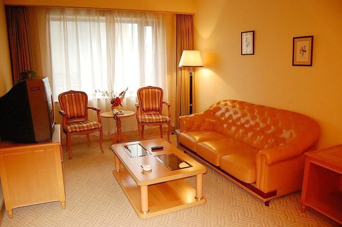 Imagen de la habitación del Hotel Delight, DALIAN. Foto 4