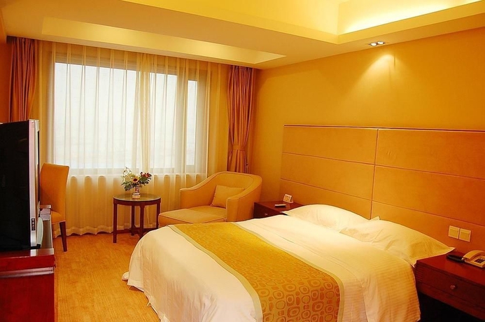 Imagen de la habitación del Hotel Delight, DALIAN. Foto 5