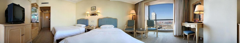 Imagen de la habitación del Hotel Delight, DALIAN. Foto 6