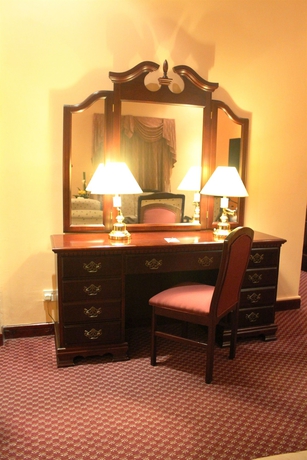 Imagen de la habitación del Hotel Delmon International. Foto 8