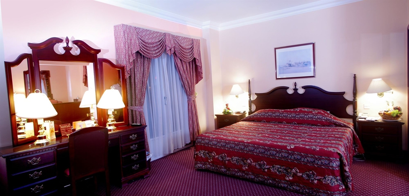 Imagen de la habitación del Hotel Delmon International. Foto 9