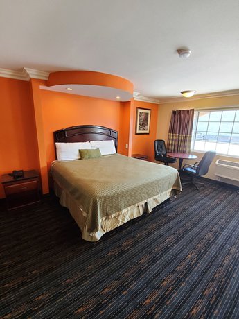 Imagen de la habitación del Hotel Delmonico Inn and Suites. Foto 4