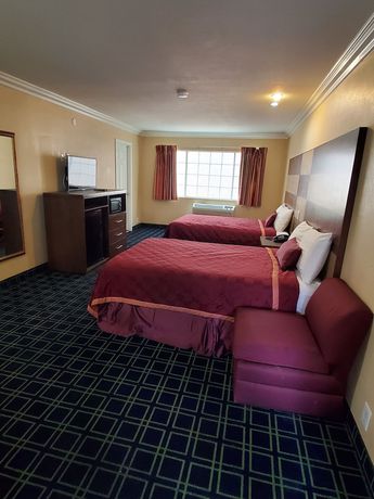 Imagen de la habitación del Hotel Delmonico Inn and Suites. Foto 5