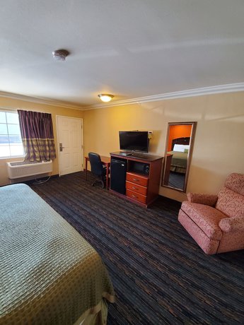 Imagen de la habitación del Hotel Delmonico Inn and Suites. Foto 7
