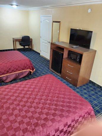 Imagen de la habitación del Hotel Delmonico Inn and Suites. Foto 9