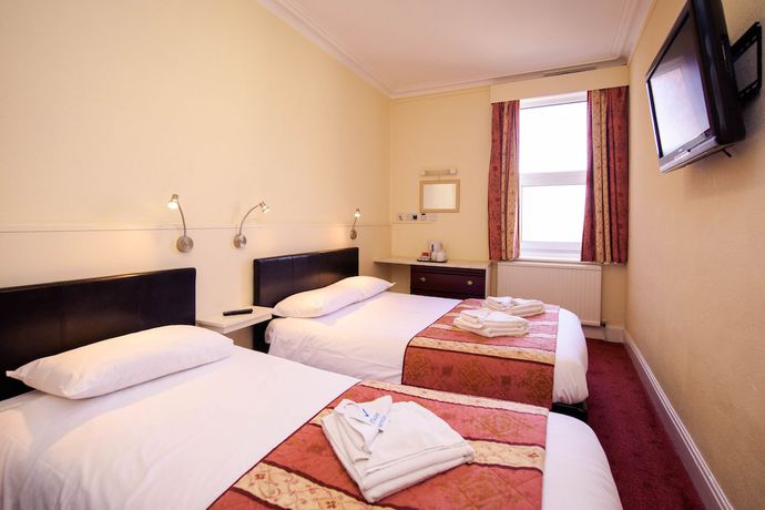 Imagen de la habitación del Hotel Delmont. Foto 19