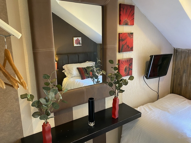Imagen de la habitación del Hotel Delovely. Foto 11