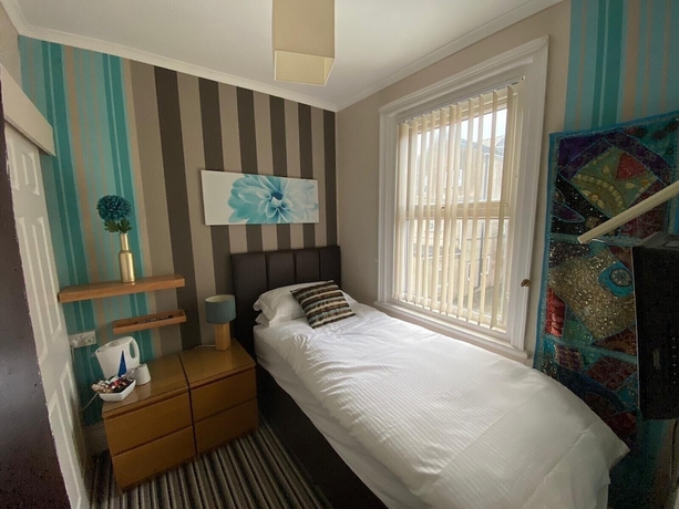 Imagen de la habitación del Hotel Delovely. Foto 12