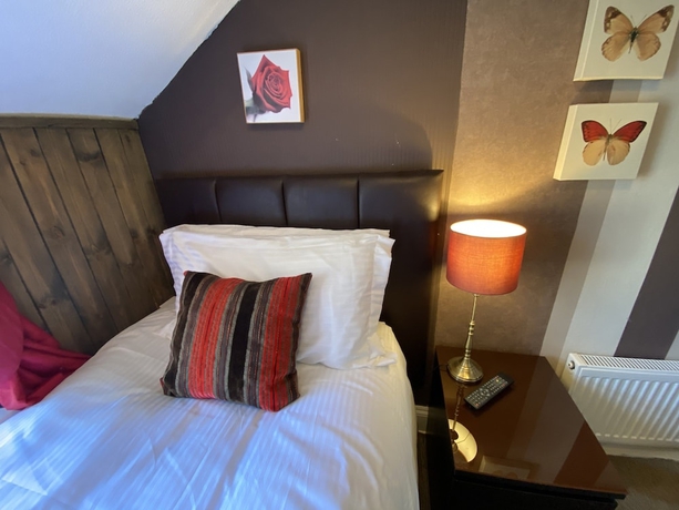 Imagen de la habitación del Hotel Delovely. Foto 14