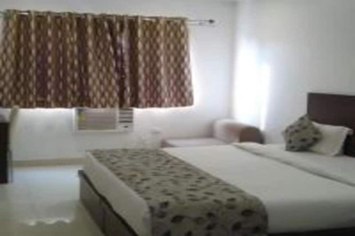 Imagen de la habitación del Hotel Delux Inn, Agra. Foto 6