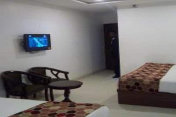 Imagen de la habitación del Hotel Delux Inn, Agra. Foto 11