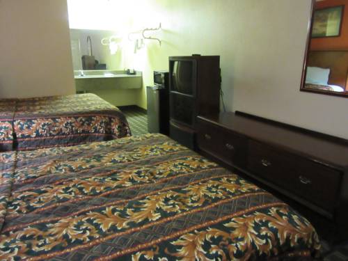 Imagen de la habitación del Hotel Deluxe Inn Irving. Foto 4