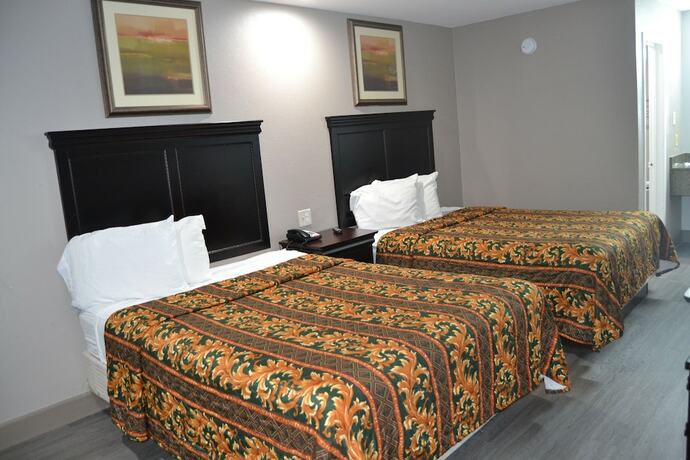 Imagen de la habitación del Hotel Deluxe Inn, Irving. Foto 9